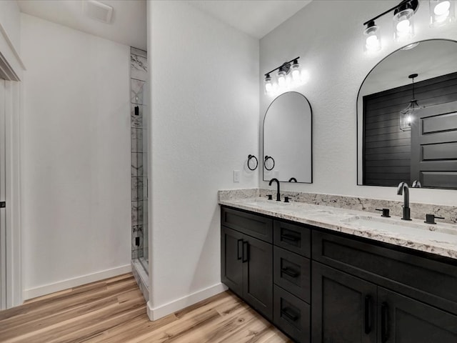 1920 Fm 842, Lufkin, TX 75901 - bathroom with wood finished floors, double vanity, and a stall shower