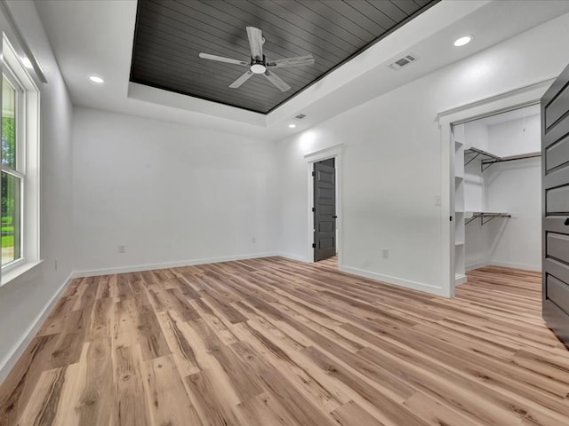 1920 Fm 842, Lufkin, TX 75901 - unfurnished bedroom with a tray ceiling, light wood finished floors, a spacious closet, wooden ceiling, and ceiling fan
