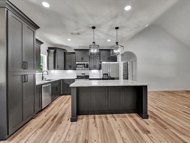 1920 Fm 842, Lufkin, TX 75901 - kitchen with stainless steel appliances, a center island, light stone countertops, backsplash, and recessed lighting