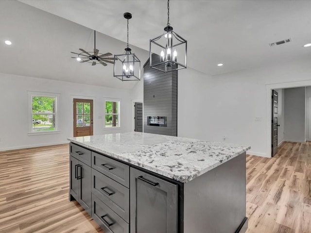 1920 Fm 842, Lufkin, TX 75901 - kitchen with a chandelier, light wood-type flooring, recessed lighting, pendant lighting, and open floor plan
