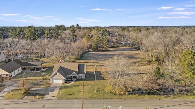 bird's eye view featuring a forest view