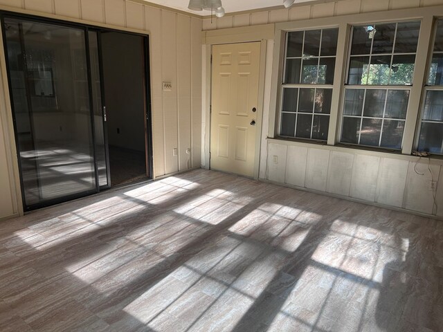 unfurnished room with wood finished floors