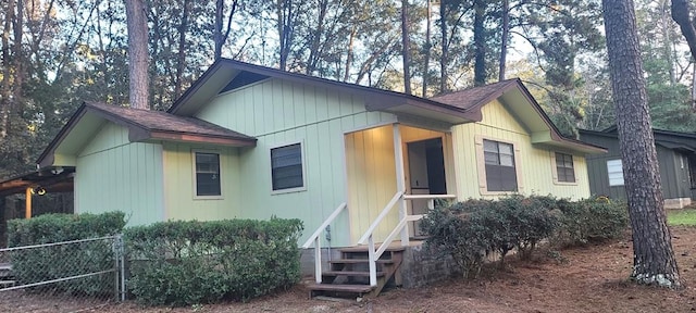 view of home's exterior featuring fence