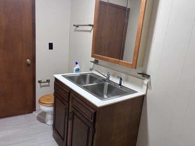 half bath with vanity and toilet