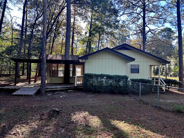 view of front of property with a wooden deck