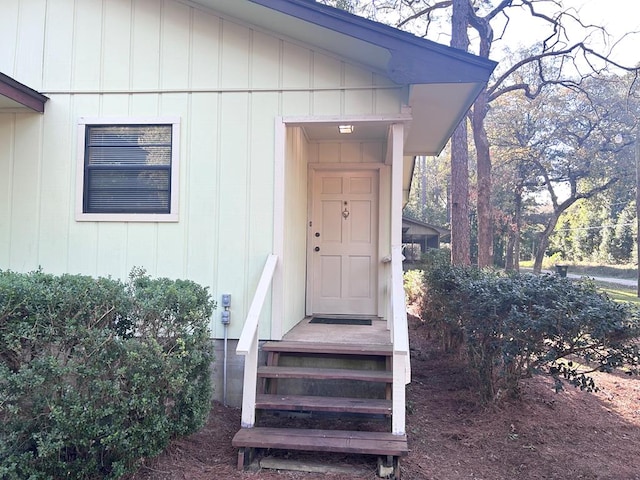 doorway to property with board and batten siding