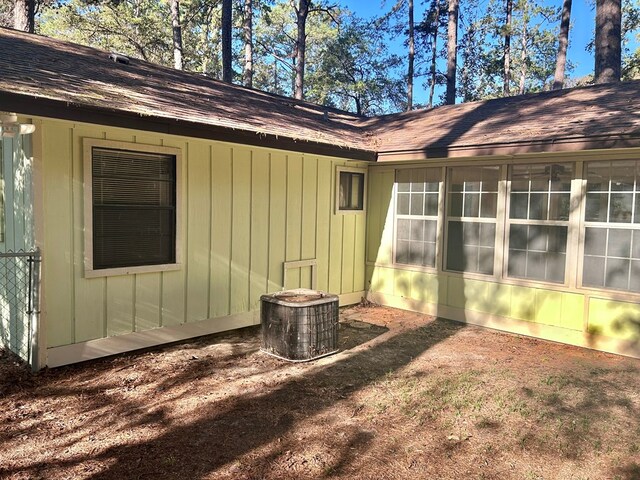 view of property exterior featuring roof with shingles