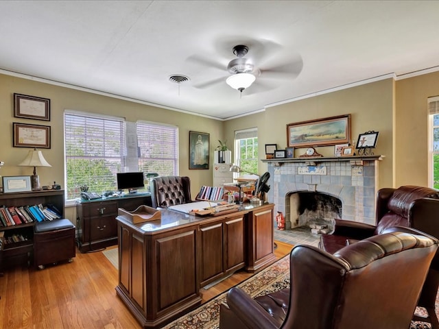 107 W Kerr Ave, Lufkin, TX 74904 - office featuring ornamental molding, light wood finished floors, ceiling fan, and a tile fireplace
