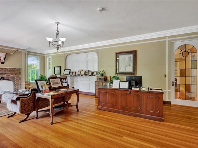 107 W Kerr Ave, Lufkin, TX 74904 - home office with light wood finished floors, a chandelier, crown molding, and a fireplace