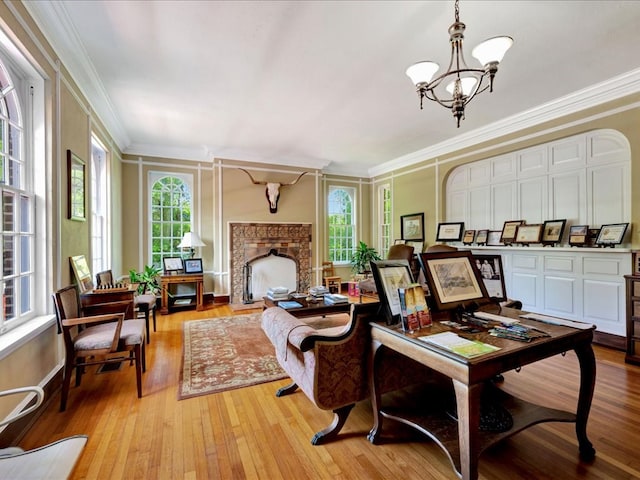 107 W Kerr Ave, Lufkin, TX 74904 - living area featuring ornamental molding, a chandelier, light wood finished floors, and a premium fireplace