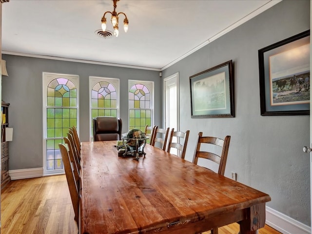 107 W Kerr Ave, Lufkin, TX 74904 - dining space with ornamental molding and light wood-style flooring