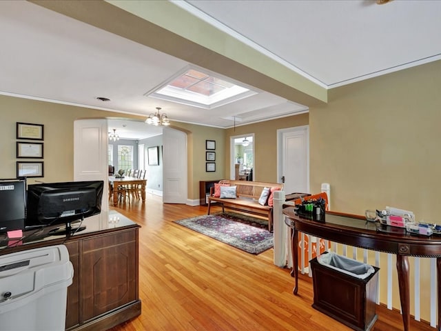 107 W Kerr Ave, Lufkin, TX 74904 - office area featuring a chandelier, light wood-style floors, plenty of natural light, and ornamental molding