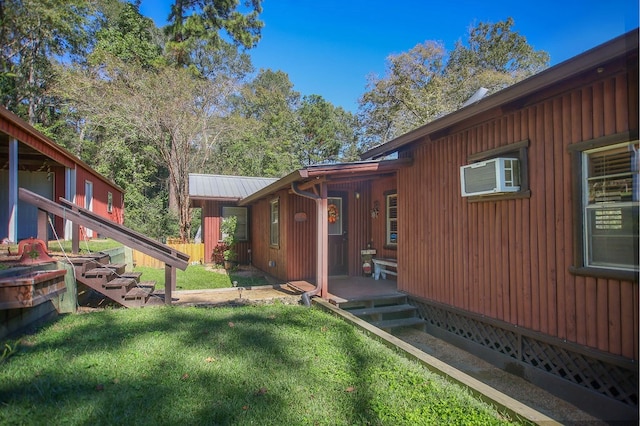 view of property exterior featuring a yard and cooling unit