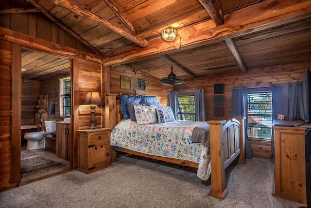 carpeted bedroom with wooden ceiling, multiple windows, and vaulted ceiling with beams