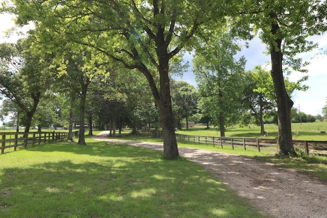 surrounding community with a lawn and a rural view