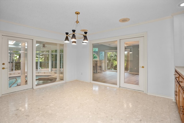109 Innisbrook Dr, Lufkin, TX 75901 - unfurnished dining area featuring ornamental molding, a chandelier, and baseboards