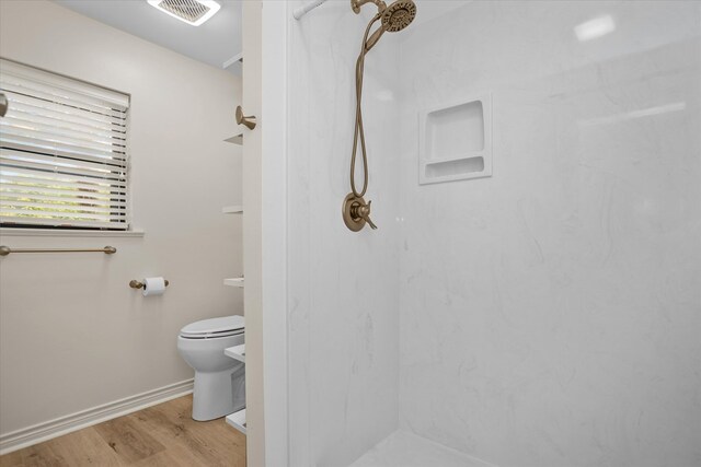 109 Innisbrook Dr, Lufkin, TX 75901 - full bathroom featuring a marble finish shower, toilet, wood finished floors, and baseboards