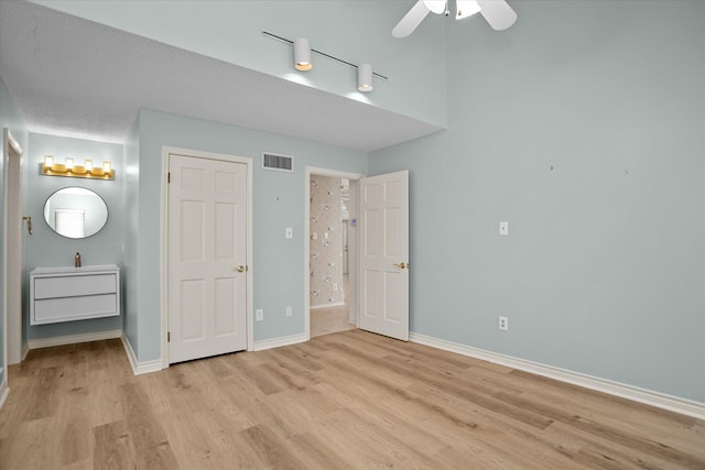 109 Innisbrook Dr, Lufkin, TX 75901 - unfurnished bedroom with light wood finished floors, baseboards, and ensuite bathroom