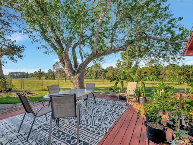 128 Tamie Lowe Rd, Moscow, TX 75960 - wooden deck featuring outdoor dining area and view of wooded area