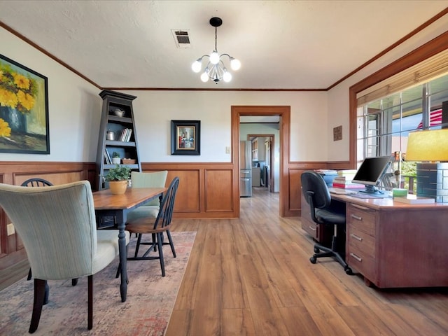 128 Tamie Lowe Rd, Moscow, TX 75960 - office space with wainscoting, a chandelier, light wood finished floors, and ornamental molding