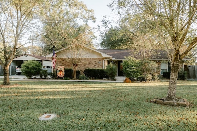 ranch-style house featuring a front lawn