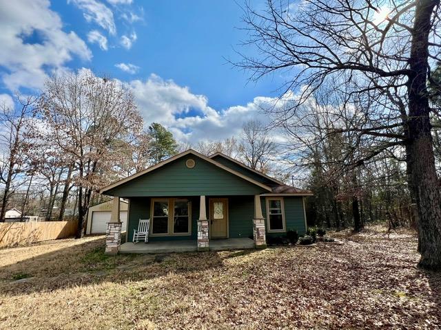 view of front of home with a garage and covered porch