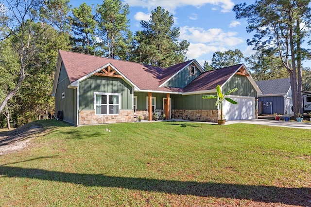 view of front of house with a front lawn, an attached garage, board and batten siding, and driveway