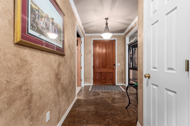 interior space with a textured ceiling, carpet floors, and crown molding