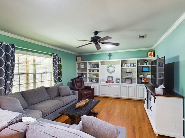 living room with ceiling fan, light wood-type flooring, and ornamental molding