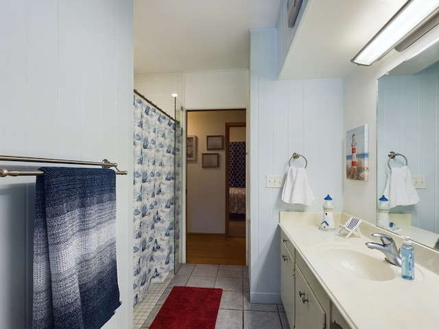 bathroom featuring tile patterned floors, a shower with curtain, wood walls, and vanity