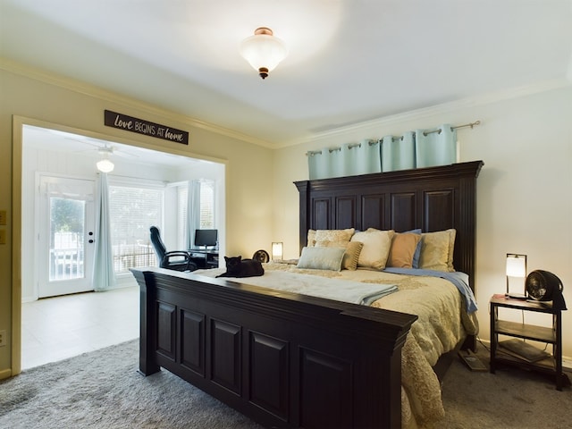 carpeted bedroom featuring ornamental molding and access to outside