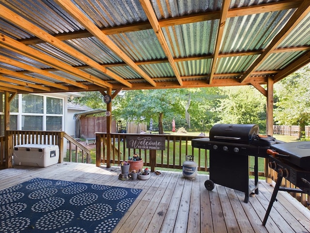 wooden terrace featuring area for grilling