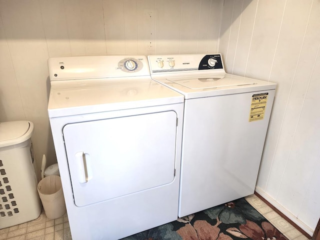 washroom featuring tile patterned floors, laundry area, and independent washer and dryer