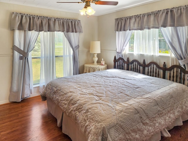 bedroom with wood finished floors and a ceiling fan