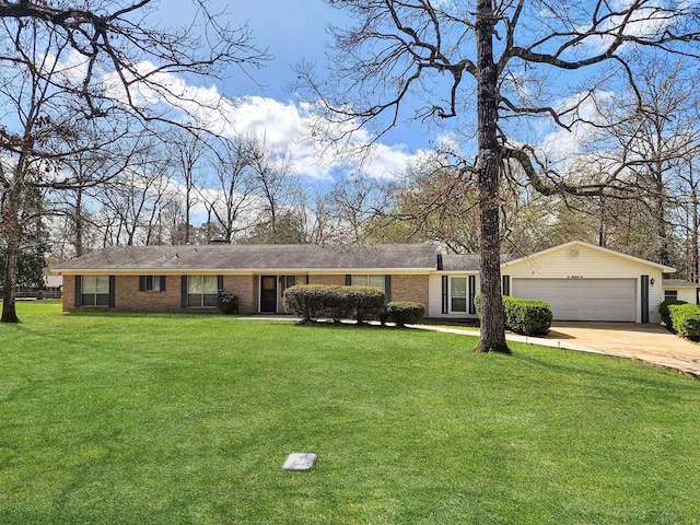 single story home featuring brick siding, driveway, an attached garage, and a front lawn