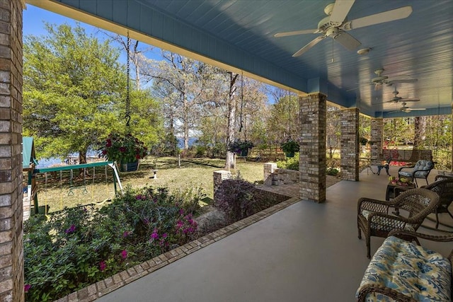 view of patio featuring ceiling fan and a trampoline