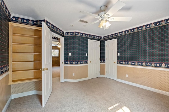 445 Riverbend Dr, Hemphill, TX 75948 - spare room featuring wallpapered walls, carpet floors, ceiling fan, and visible vents