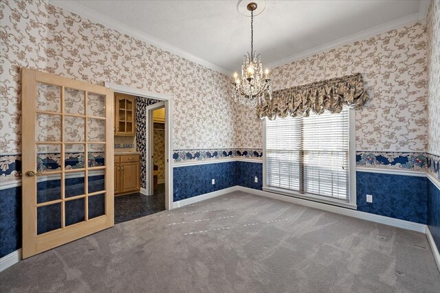 carpeted empty room with crown molding