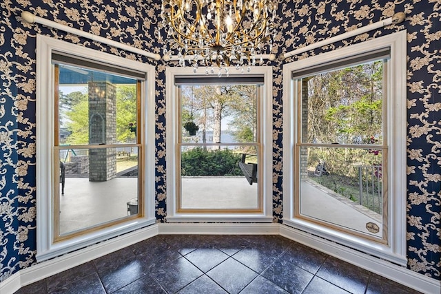 445 Riverbend Dr, Hemphill, TX 75948 - room details with baseboards, wallpapered walls, and a notable chandelier