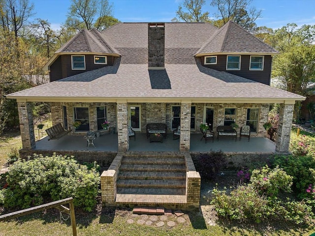 view of front of home featuring an outdoor living space and a patio