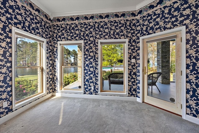 445 Riverbend Dr, Hemphill, TX 75948 - spare room featuring wallpapered walls, carpet floors, plenty of natural light, and crown molding