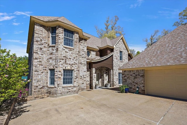 445 Riverbend Dr, Hemphill, TX 75948 - view of front facade with brick siding and a garage