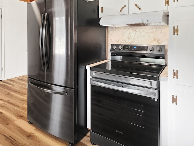 4296 US Highway 190 W, Jasper, TX 75951 - kitchen with stainless steel appliances, under cabinet range hood, light wood-type flooring, and white cabinets