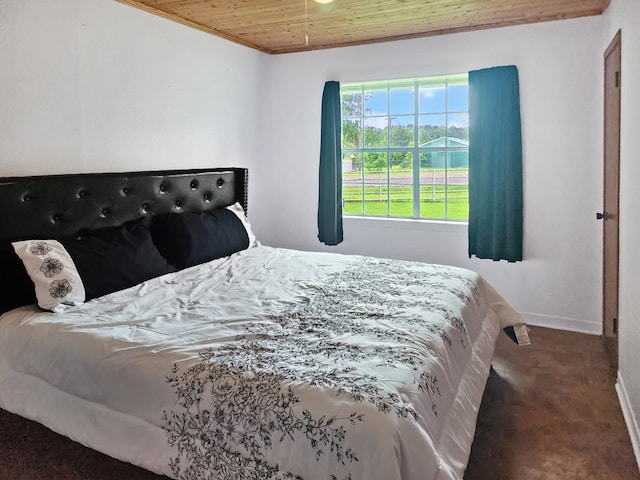 4296 US Highway 190 W, Jasper, TX 75951 - carpeted bedroom with wooden ceiling and baseboards