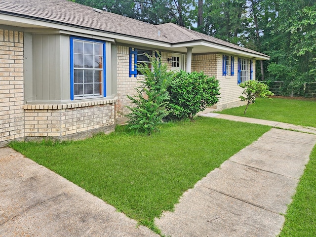4296 US Highway 190 W, Jasper, TX 75951 - ranch-style house with brick siding, a front lawn, and a shingled roof
