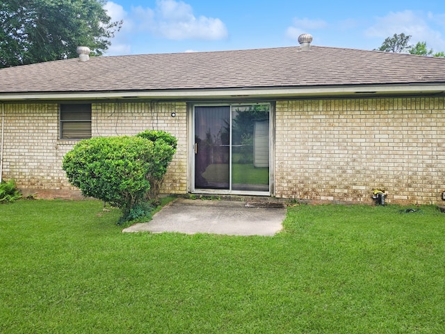 4296 US Highway 190 W, Jasper, TX 75951 - rear view of house with brick siding, roof with shingles, and a patio