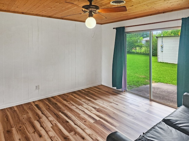 4296 US Highway 190 W, Jasper, TX 75951 - spare room with wood ceiling, ceiling fan, baseboards, wood finished floors, and wood walls