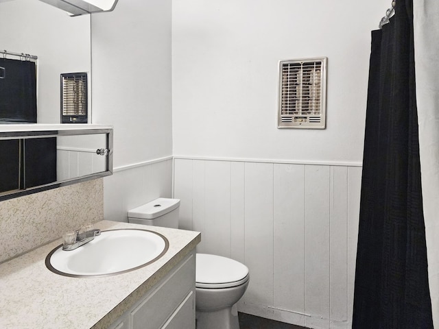 4296 US Highway 190 W, Jasper, TX 75951 - bathroom featuring toilet, a wainscoted wall, vanity, and backsplash