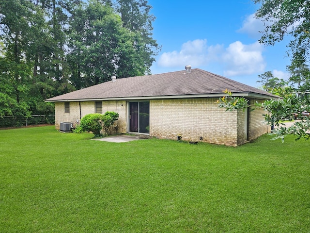 4296 US Highway 190 W, Jasper, TX 75951 - back of property with brick siding, a shingled roof, and central AC