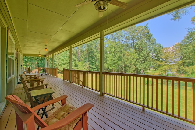 wooden deck featuring ceiling fan